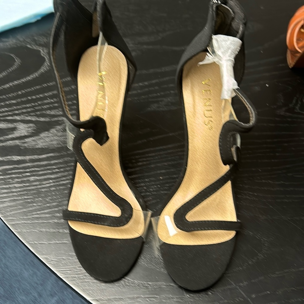 Venus black heels with plastic straps. Sueded